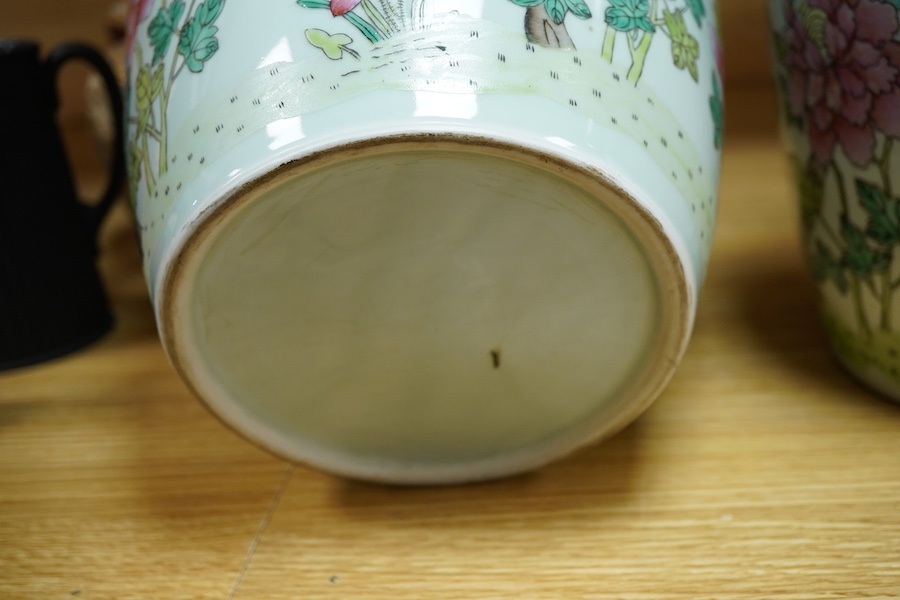 A pair of Chinese famille rose baluster vases decorated with flowers, 36cm high